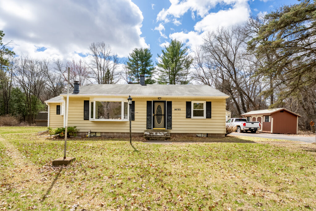 Spring home exterior in the Chippewa Valley Wisconsin during snow melt season