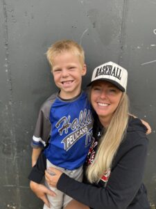 Casey Levrich and son at Hallie Youth Days baseball